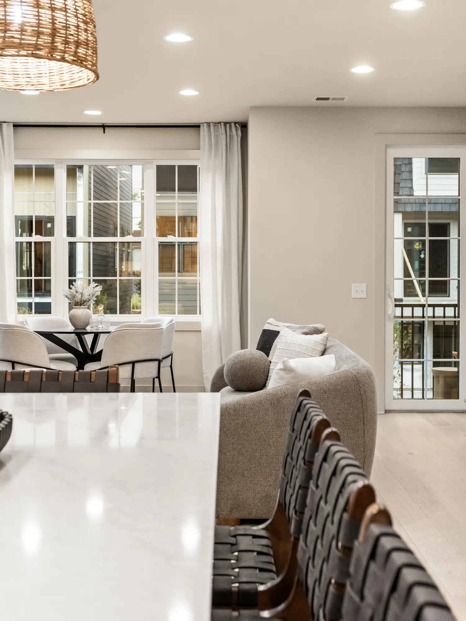 solaya-financing-10-kitchen-island-living Kitchen island, dining nook and living room in a home at Solaya at the Lanes